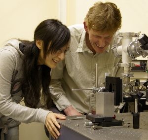 Researchers at the University examine the explosive detection experimental setup.