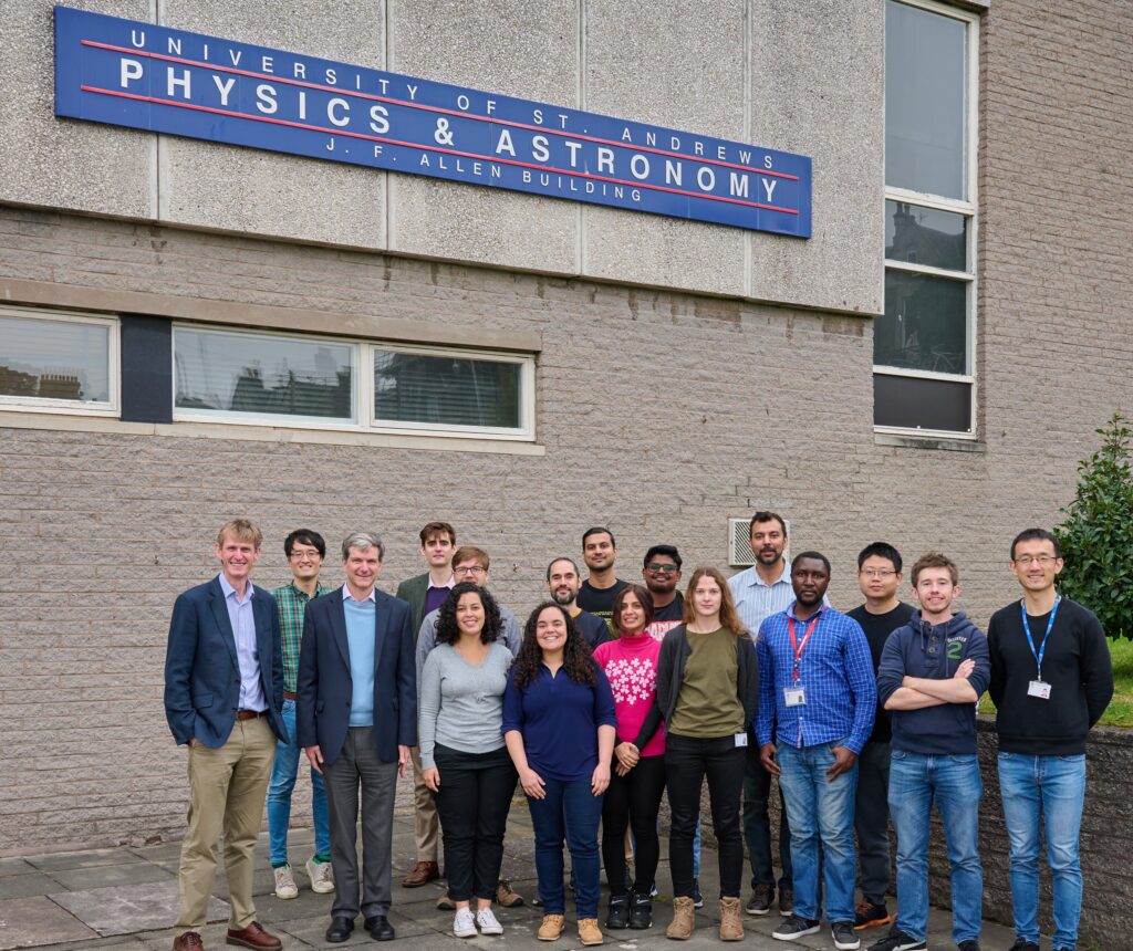 The OSC group stood outside the school of physics and astronomy. From left to right: Graham, Kou, Ifor, Thomas, Stefan, Marianna, Michele, Alfonso, Ramakant, Mina, Aswin, Egle, Hassan, Edward, Junyi, Peter, Leon